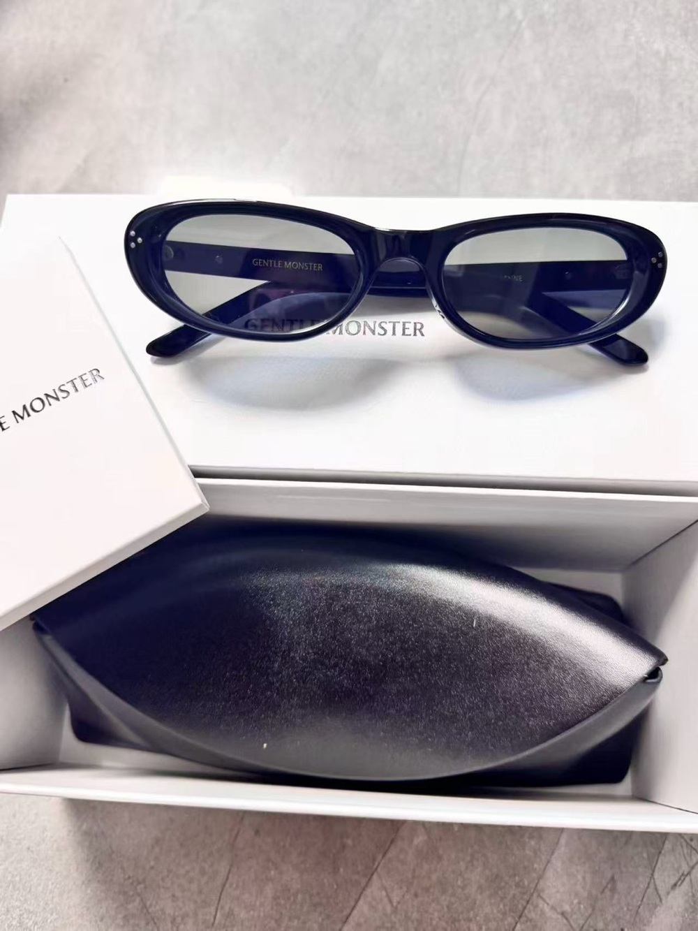 GENTLE MONSTER Black Oval Sunglasses with Dark Lenses